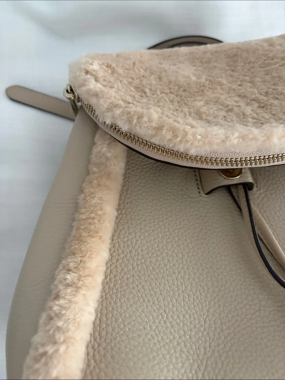 kate spade beige faux-shearling flap backpack